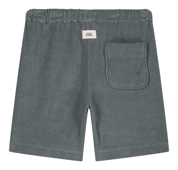 Bermuda éponge de coton biologique. Confortable et agréable à porter. Couleur bleue. 2 poches latérales et une poche au dos. 